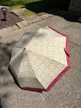 Coach umbrella with tags